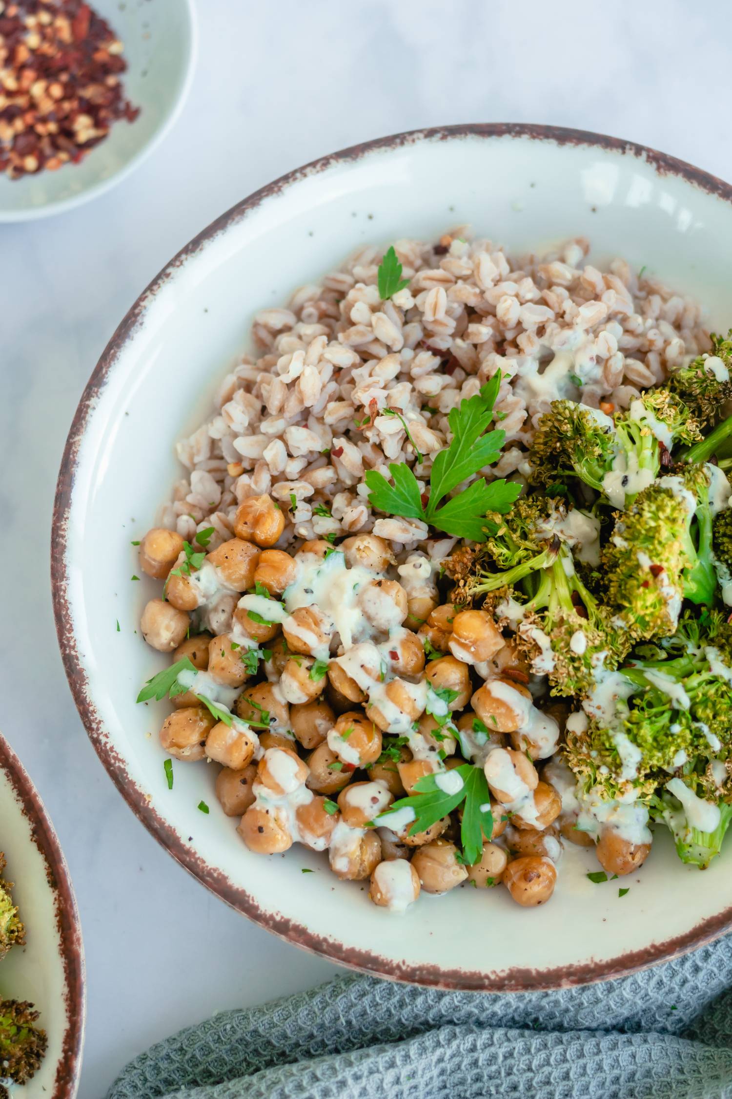 Farro bowl with broccoli, chickpeas, and tahini garlic dressing. 