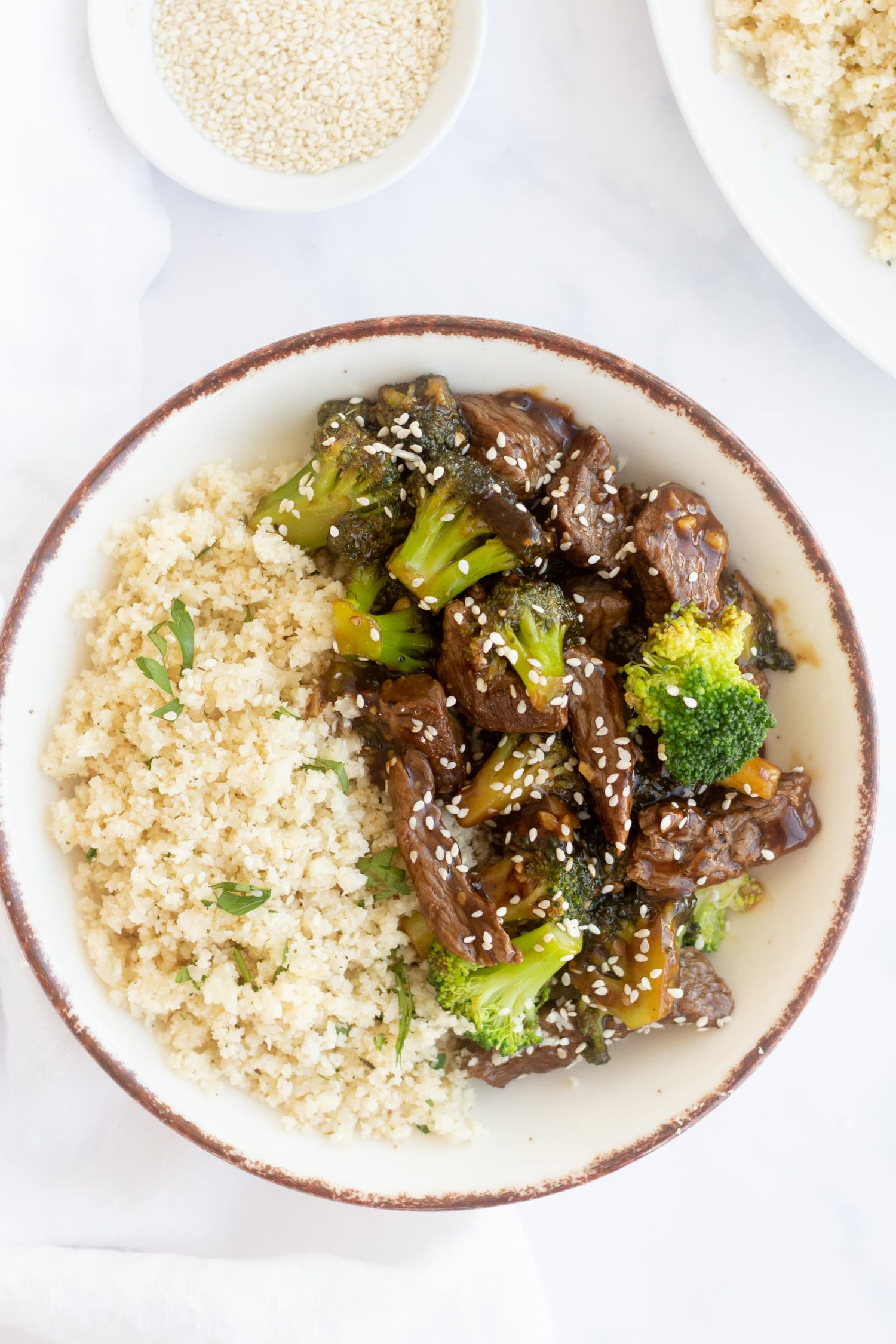 Takeout inspired Chinese beef and broccoli with bright green broccoli and stir fried beef in a light sauce.