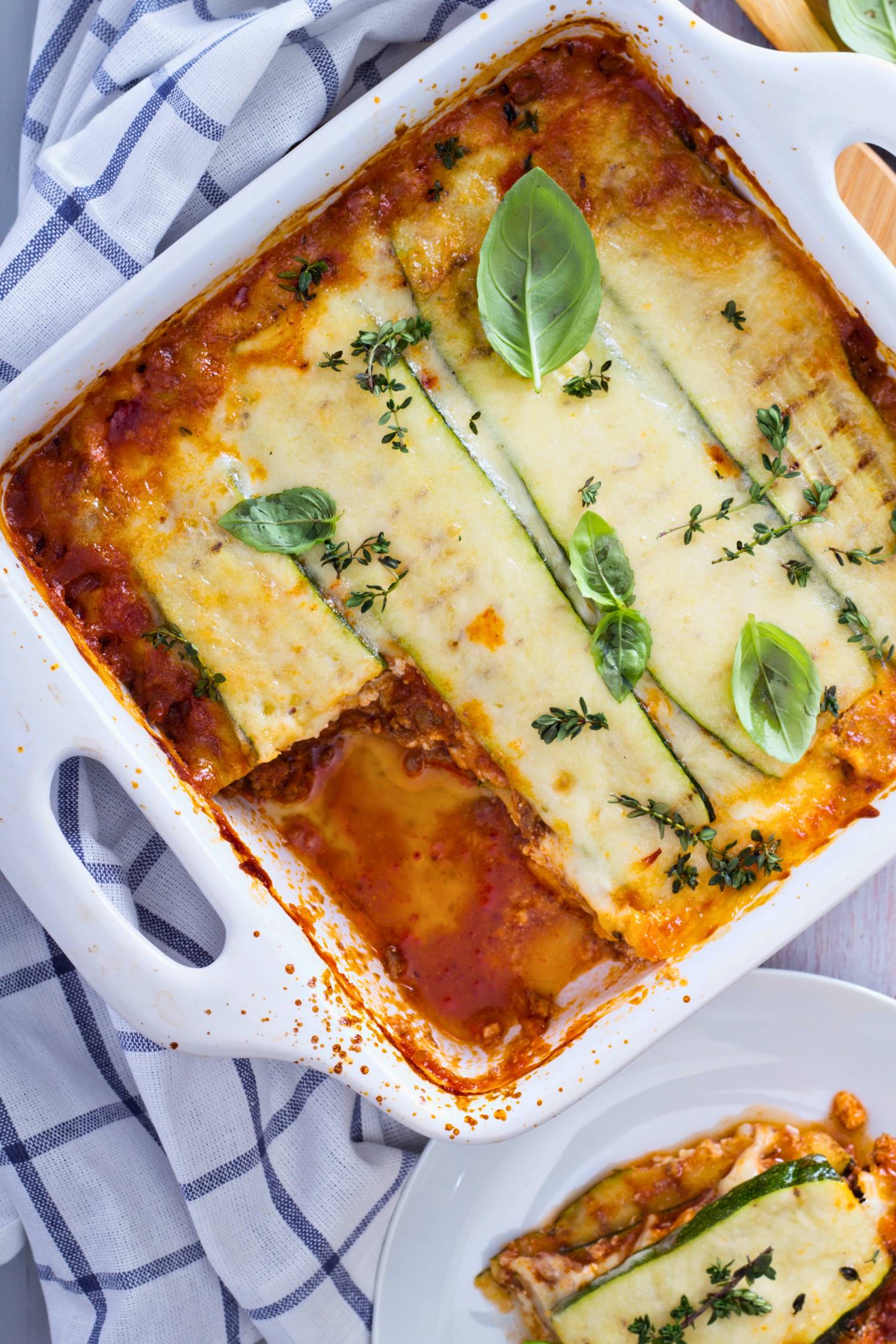 Low carb zucchini lasagna with mozzarella cheese, basil, and marinara sauce.