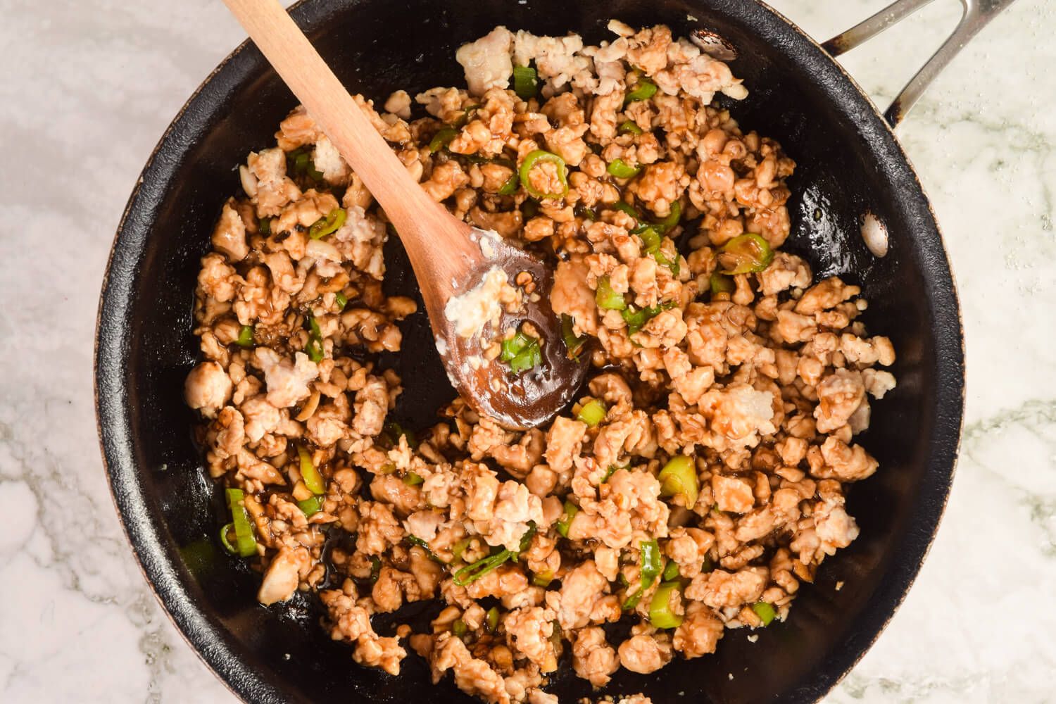 Healthy Mongolian Chicken made with ground lean chicken, green onions, and a soy and garlic sauce.