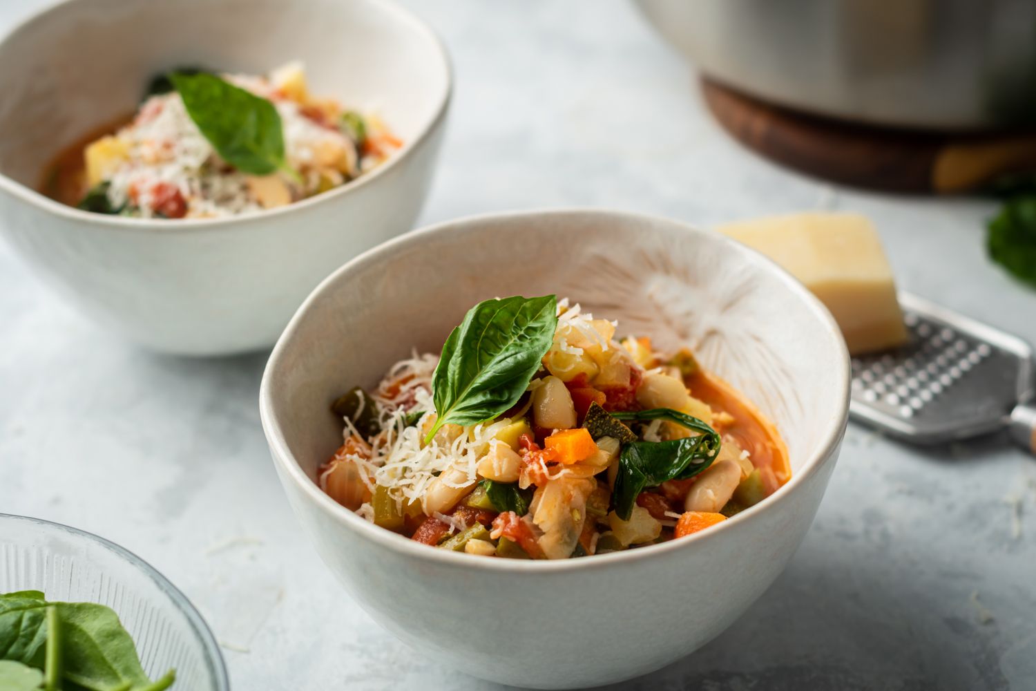 Cannellini bean and vegetable soup with Italian flavors including tomatoes and garlic.