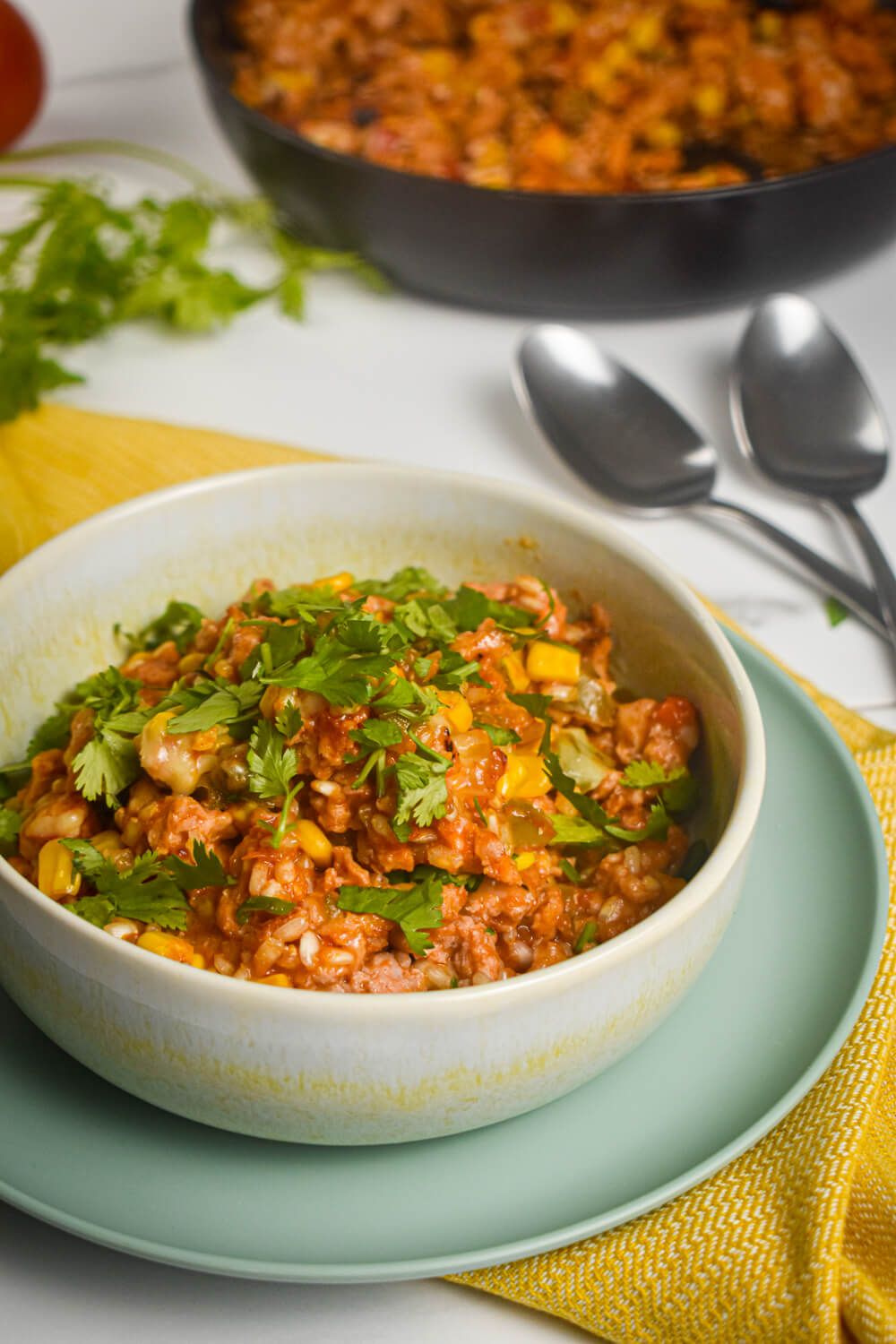 Turkey taco skillet in a bowl with brown rice, black beans, ground turkey, and taco seasoning.