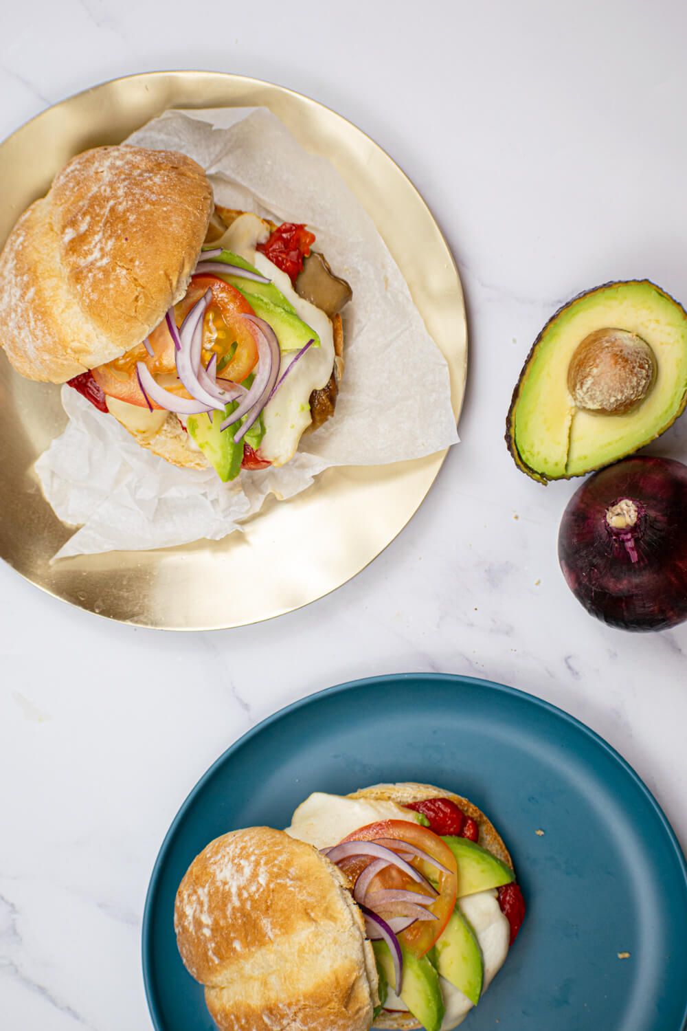 Portobello Mushroom Burgers with mozzarella, red peppers, and avocado.