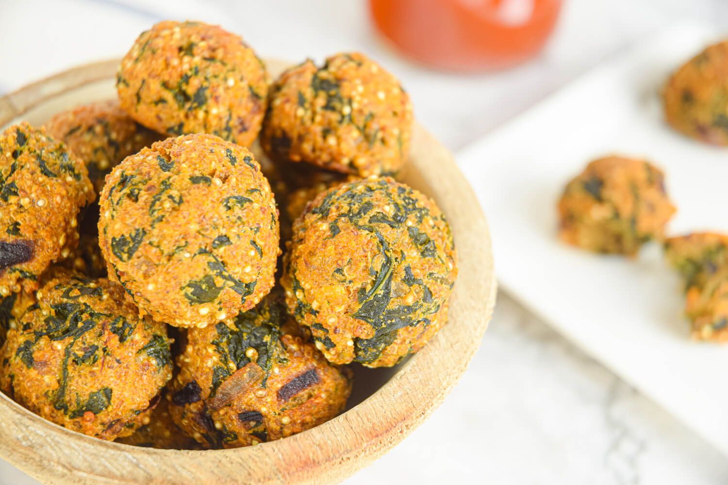 Meatballs made with quinoa and spinach in a bowl.