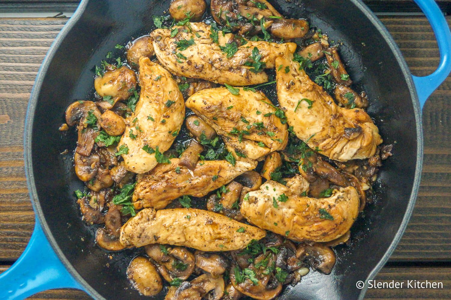 Balsamic Chicken with Garlic Zucchini Noodles in a cast iron skillet with parsley