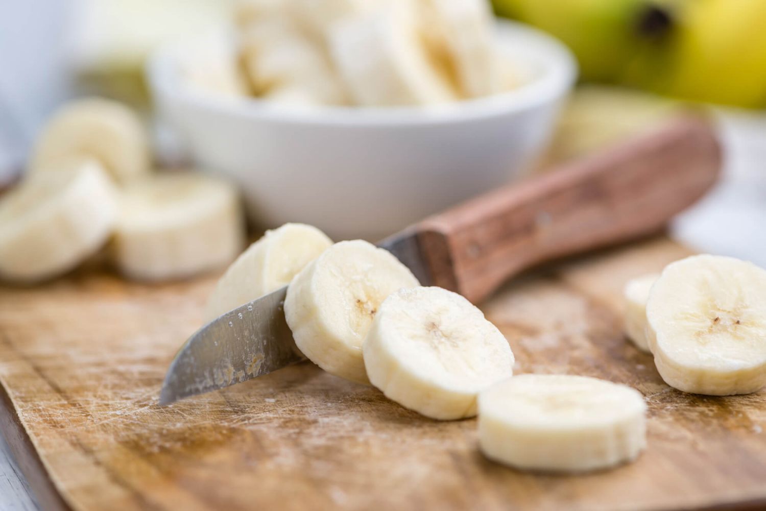 Nutritious bananas on a cutting board with a knife