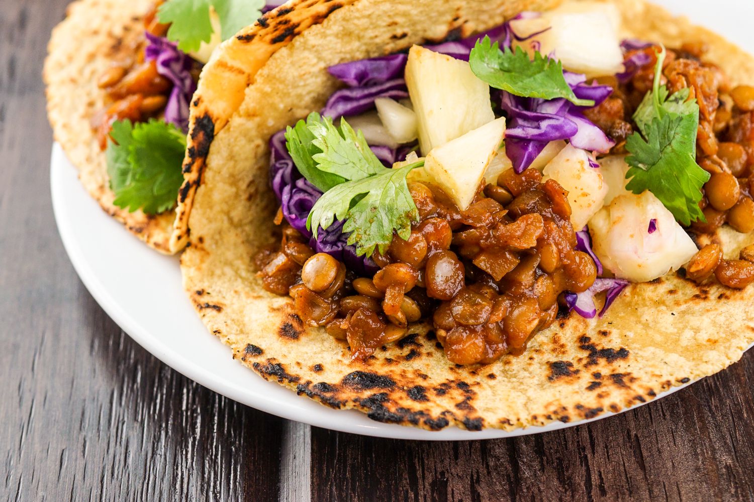 Lentil tacos on corn tortillas with purple cabbage slaw.