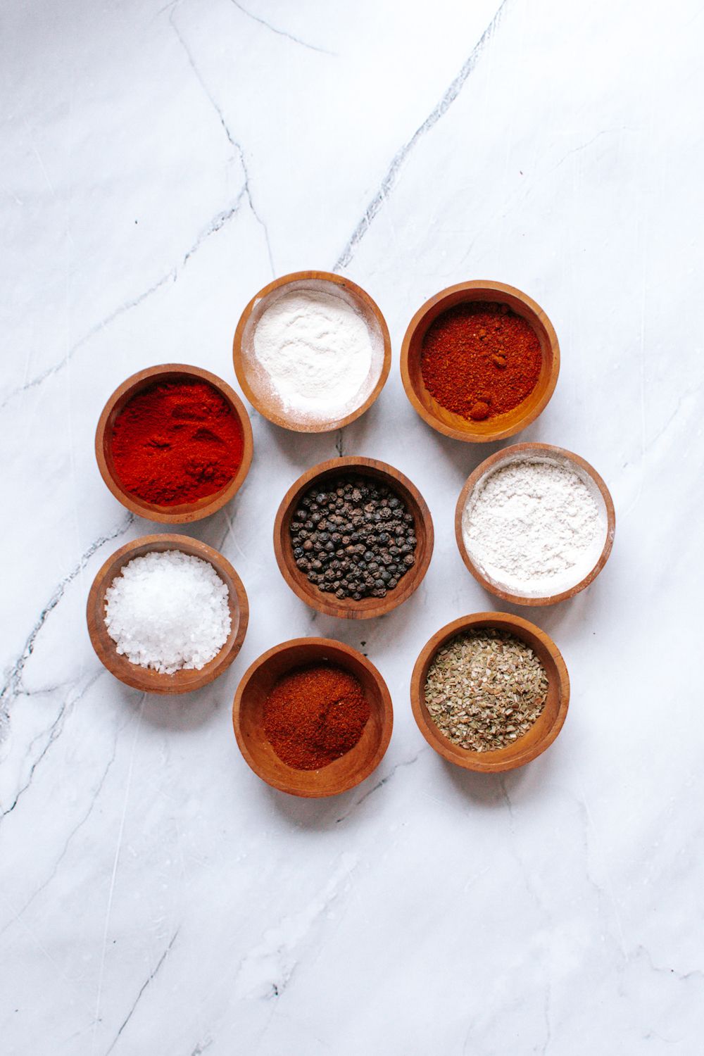 Small bowls of spices to make blackening seasoning including smoked paprika, 