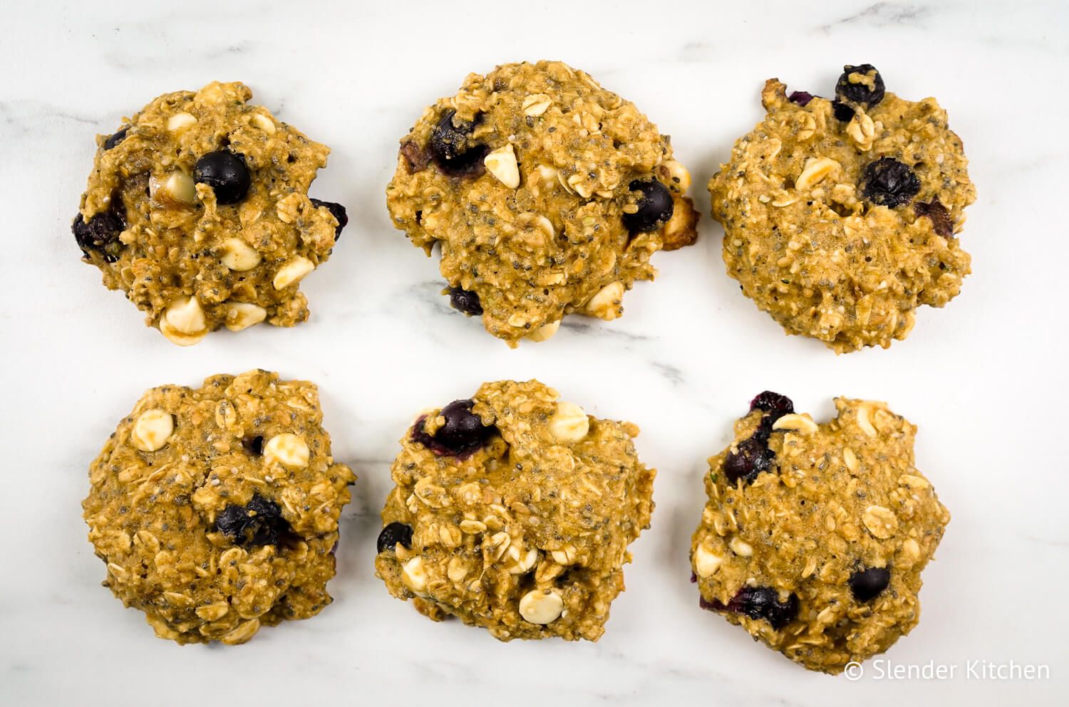 Blueberry banana breakfast cookies with oats, chocolate chips, chia seeds, and fresh blueberries.