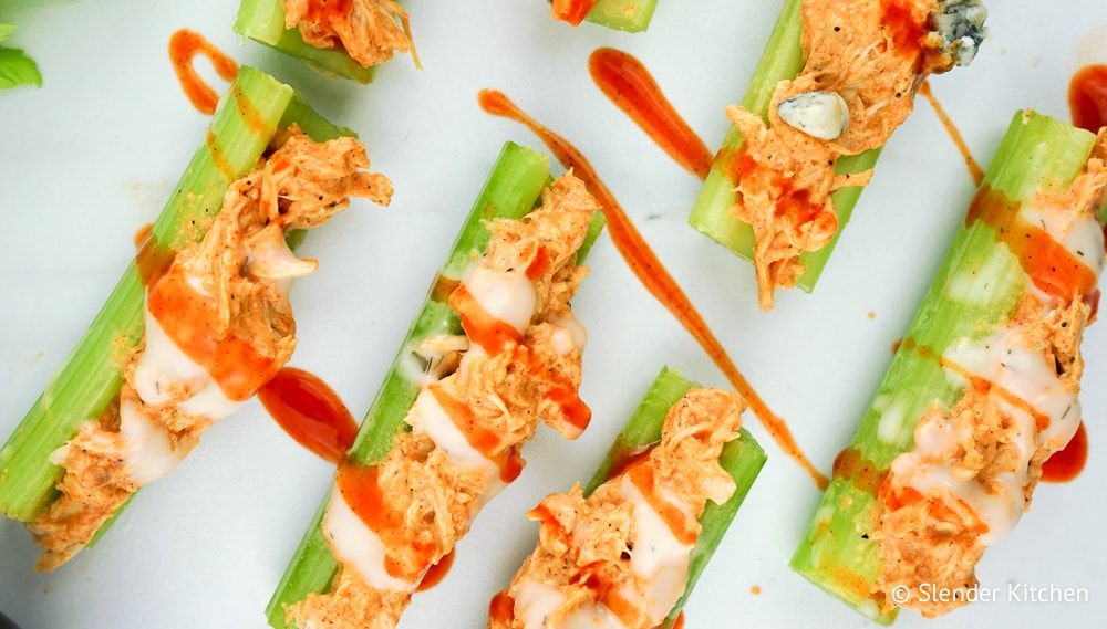 Buffalo Chicken Celery Bites with ranch dressing and blue cheese.