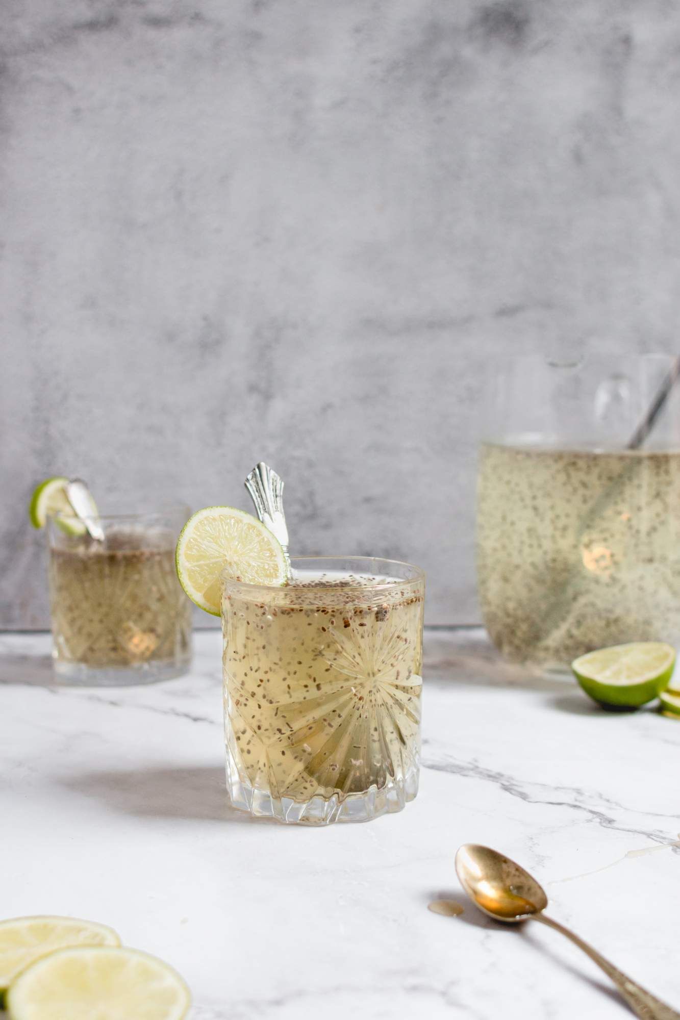 Chia lime fresca drink with floating chia seeds in water and lime juice.