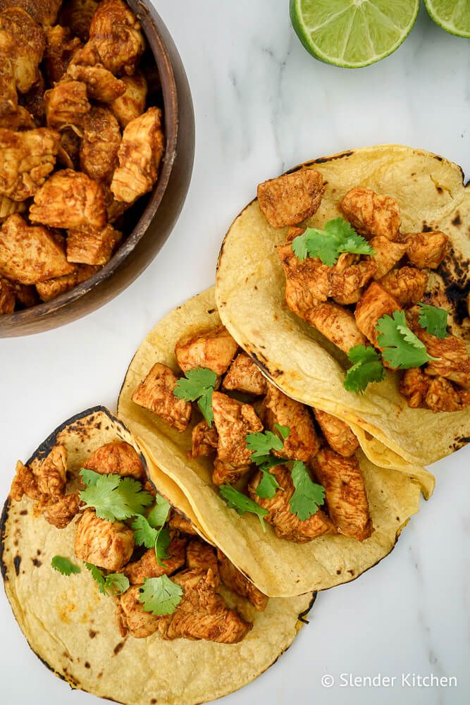 Frozen chicken tacos  with corn tortillas, cilantro, and avocado.