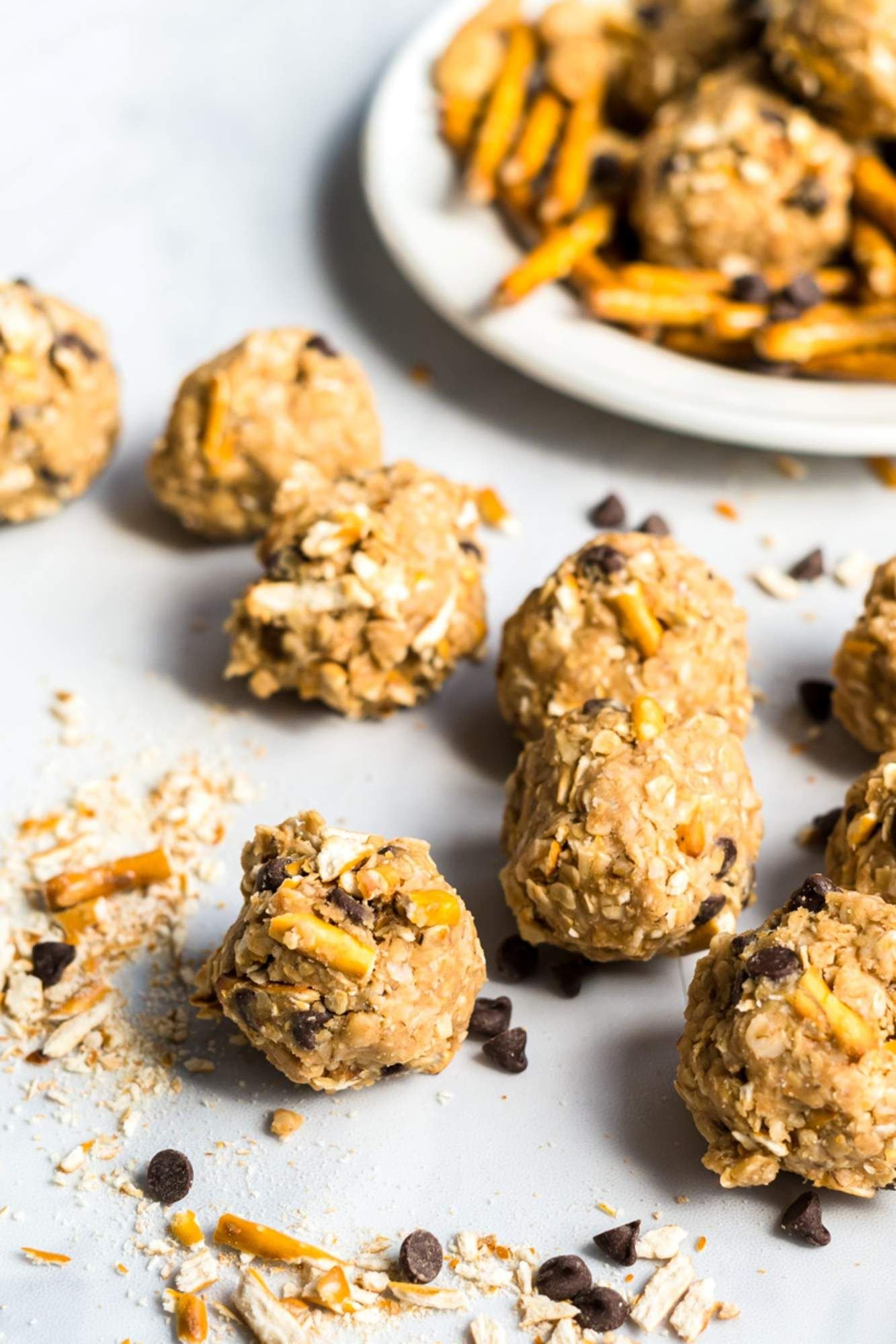 Peanut butter chocolate oatmeal energy balls with pretzels and chocolate chips.