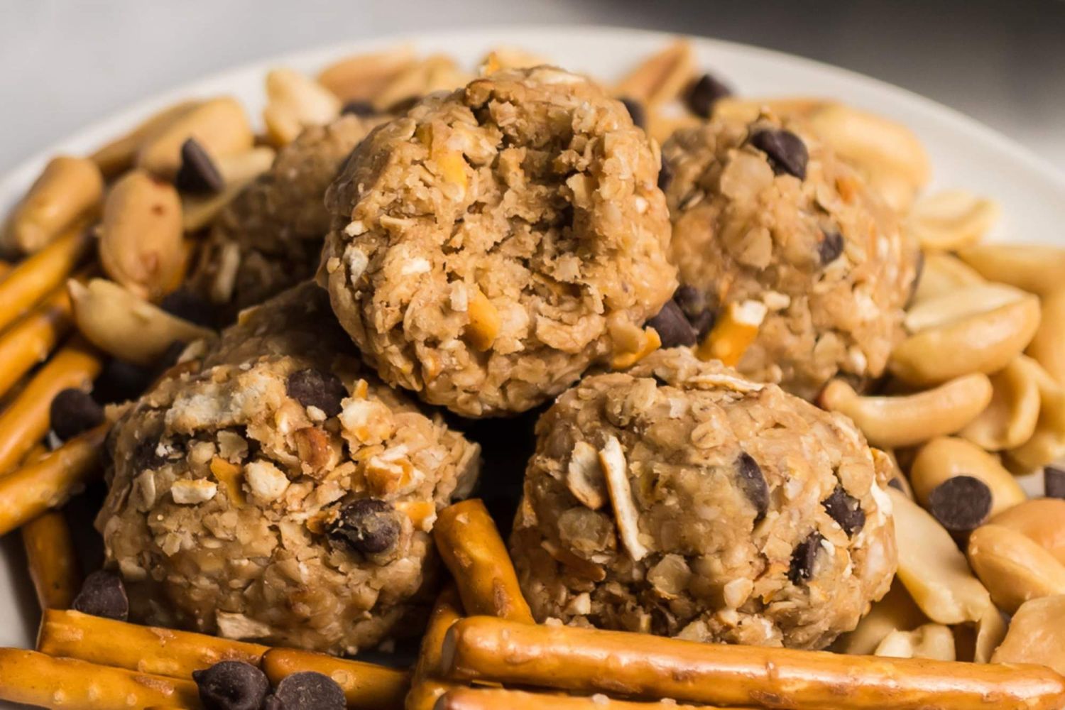 Pretzel peanut butter energy balls with chocolate chips rolled into balls with oats.