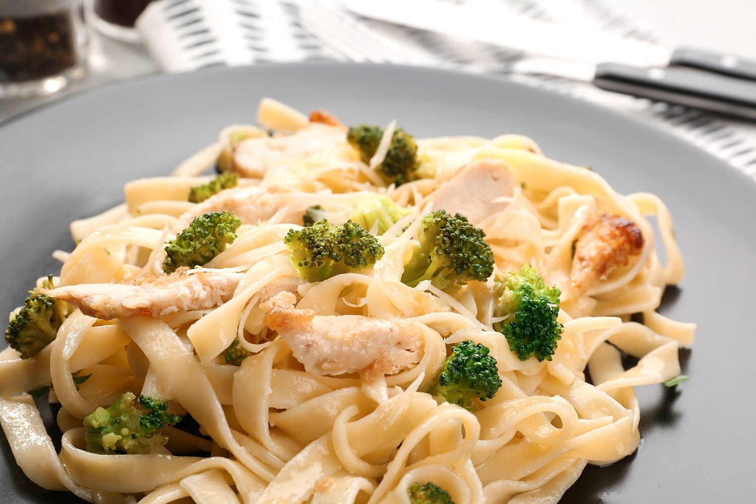 Creamy Chicken and Broccoli Pasta with fresh lemon and plenty of Parmesan.