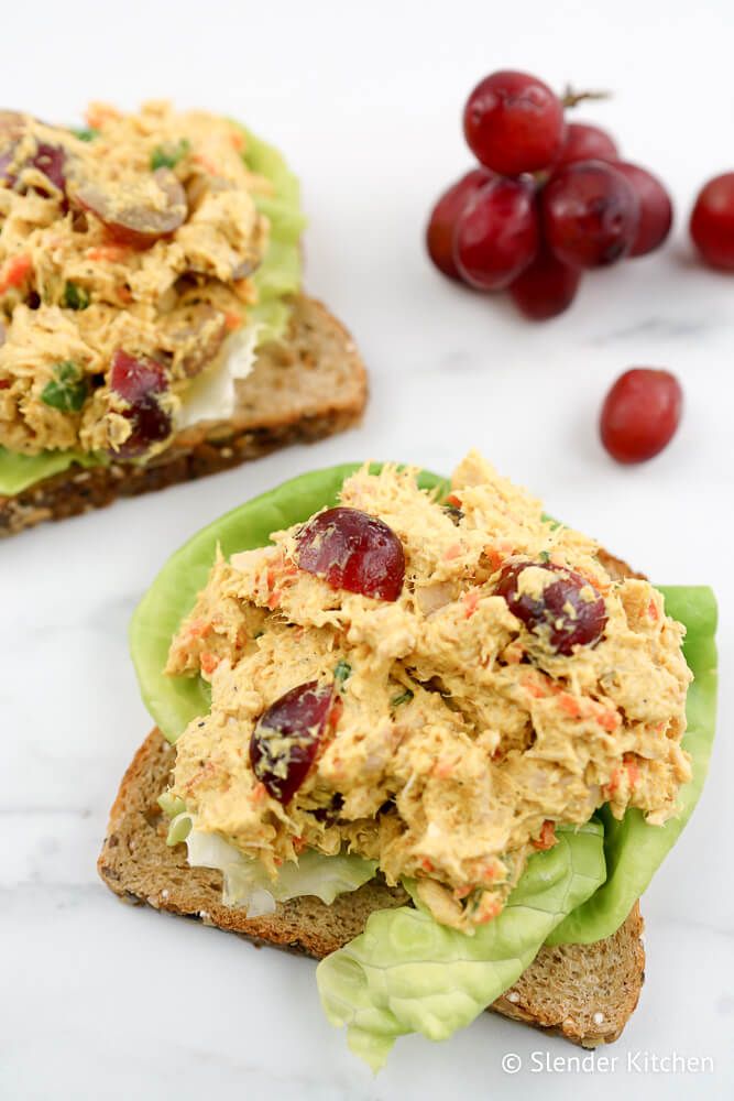 Tuna salad with curry and red grapes on wheat bread with lettuce.