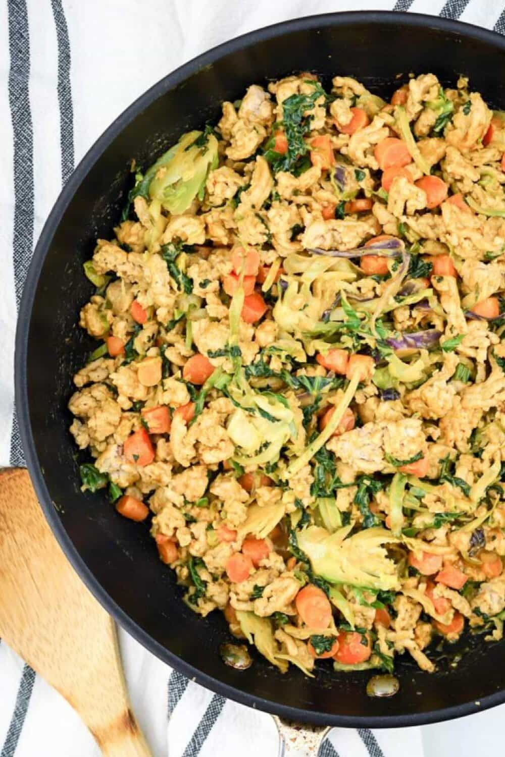 Peanut ground chicken stir fry with vegetables and peanut sauce.