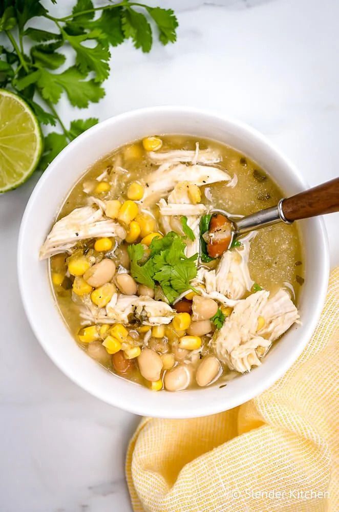 White Chicken Chili with beans, chicken, and corn with cilantro and lime.