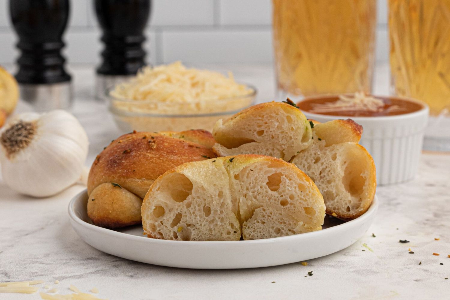 Greek yogurt dough garlic knot cut in half to show air bubbles.