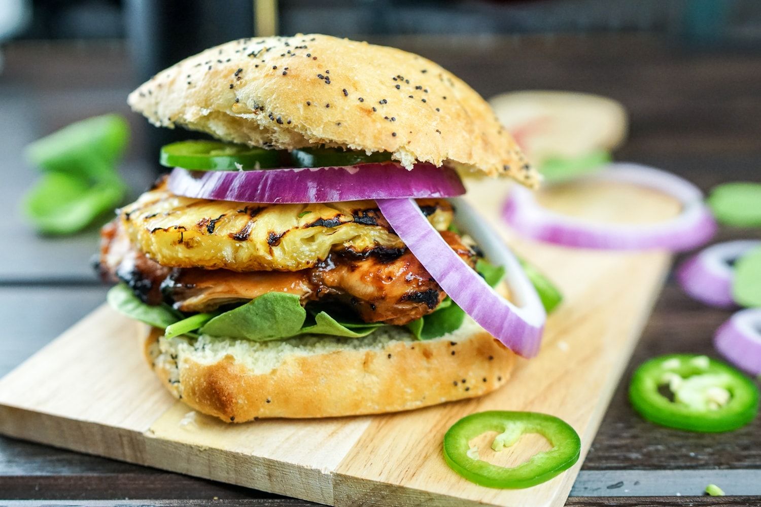 Grilled Hawaiian Chicken Sandwiches with barbecue sauce, red onion, and jalapenos.