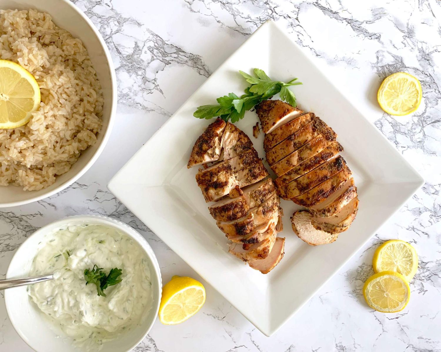 Lemon chicken breast that has been grilled with oregano and thyme.