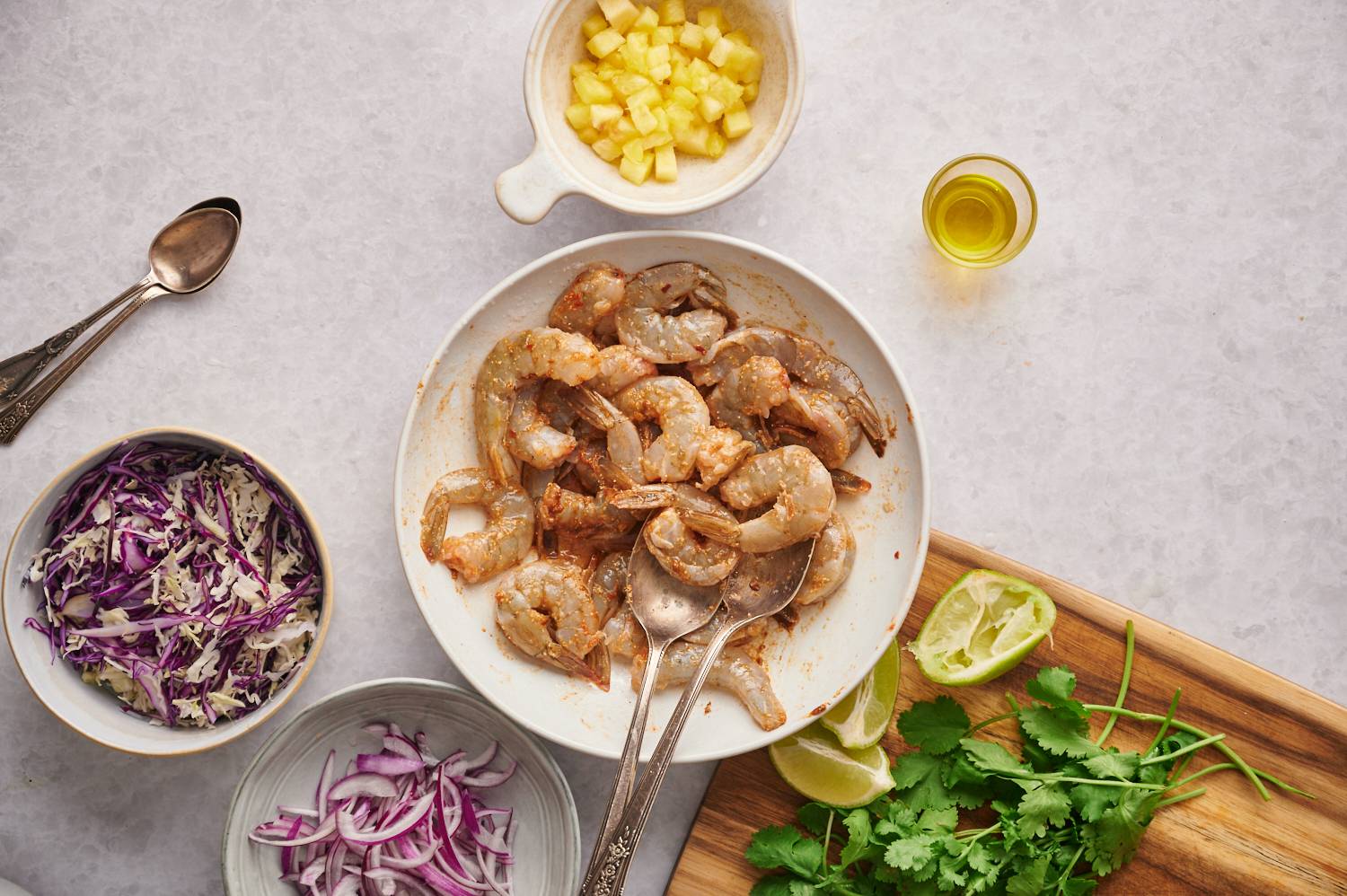 Seasoned shrimp for grilled shrimp tacos with pineapple slaw and corn tortillas.