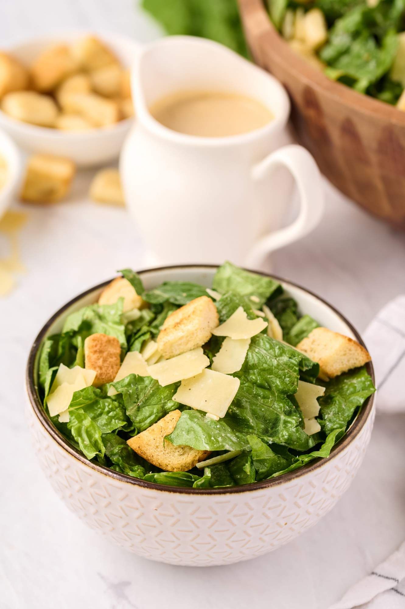 Greek yogurt caesar salad with croutons, Romaine lettuce, Parmesan cheese, and Caesar dressing.