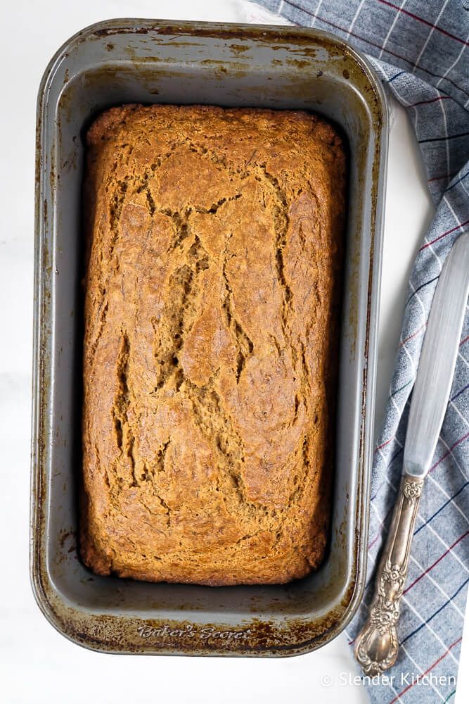 Wheat banana bread with cinnamon in a bread pan.