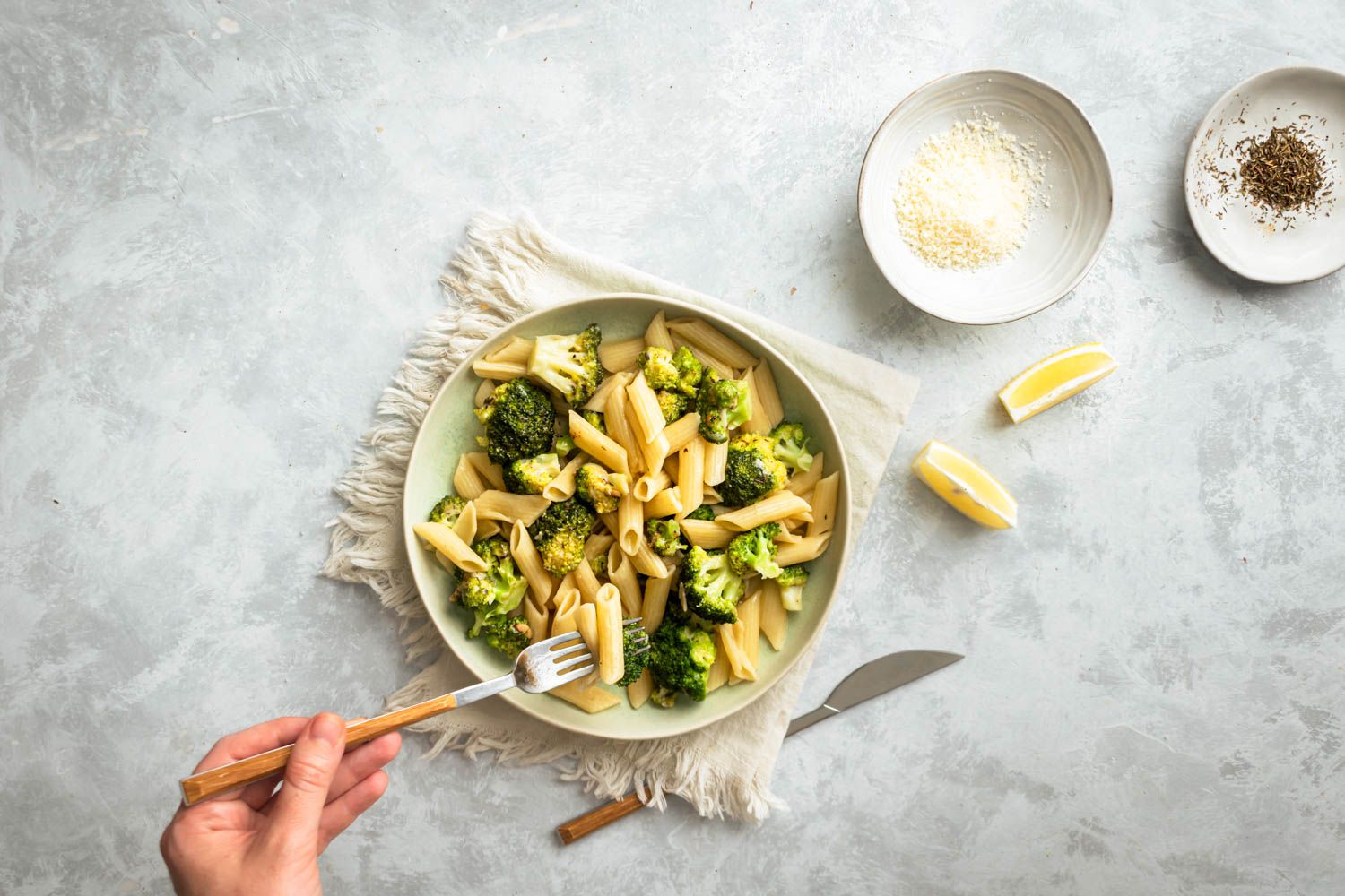 Broccoli pasta with fresh lemon, garlic, and Italian seasoning with Parmesan cheese and black pepper.