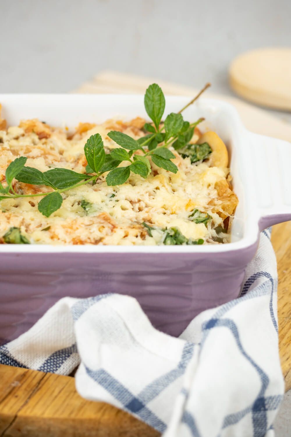 Turkey Spaghetti Squash casserole with spinach, mushrooms, tomatoes, and cheese.