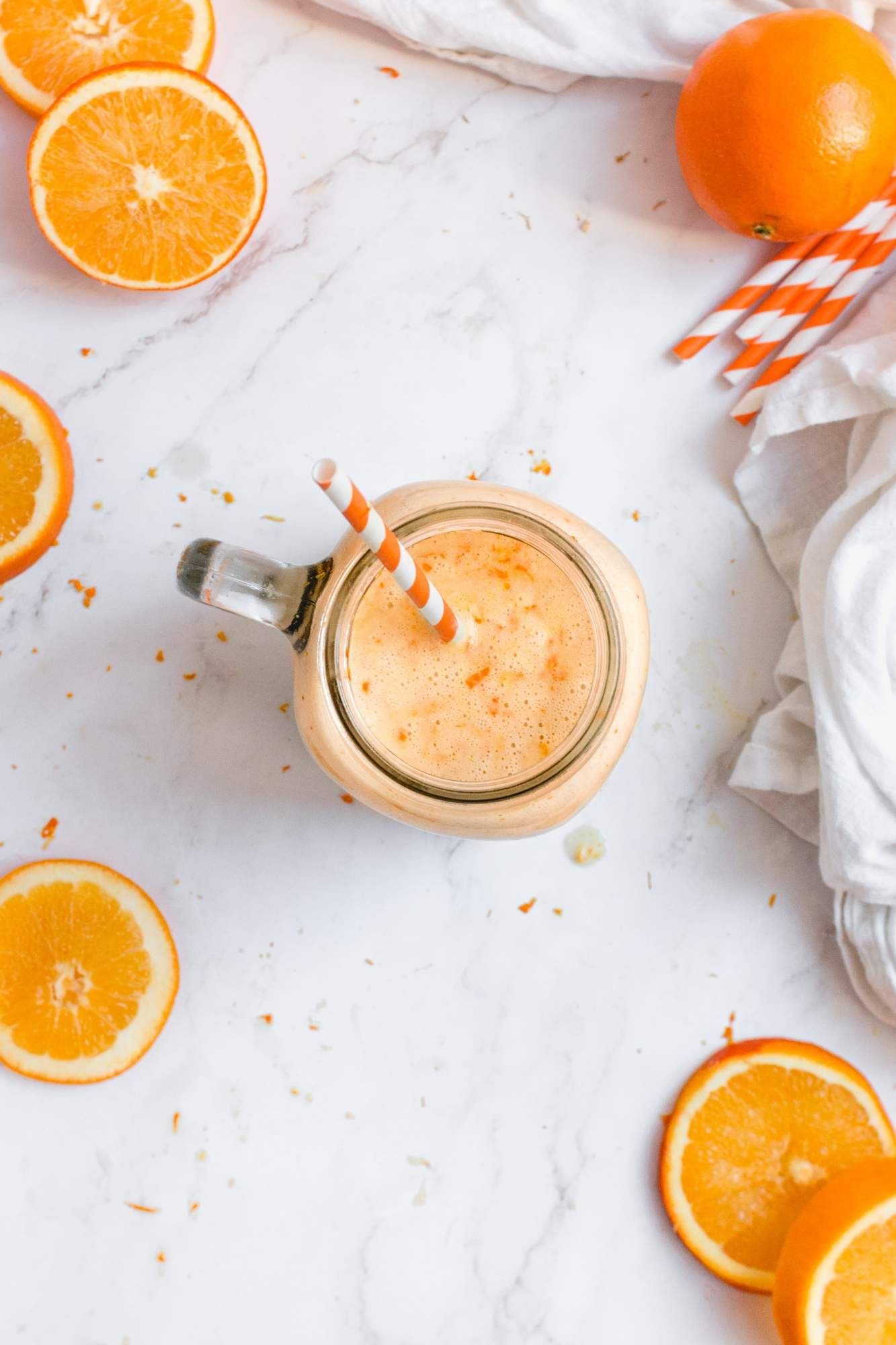 Orange smoothie with bananas, oranges, almond milk, and vanilla extract to make a creamsicle.