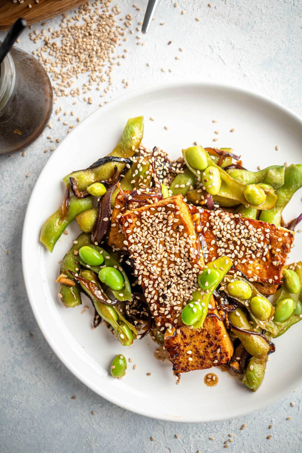 Extra firm pan-fried tofu in a sweet and spicy Asian sauce with edamame and sesame seeds. 