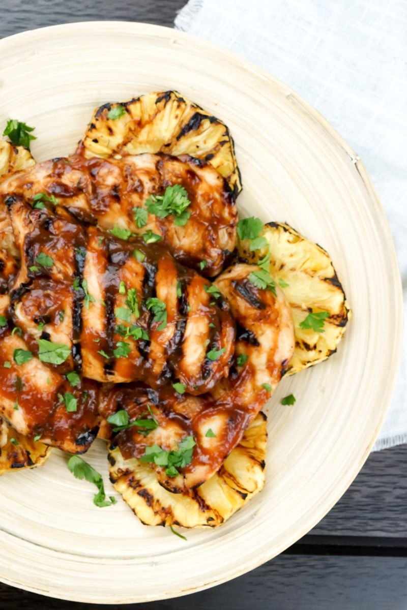 Grilled Pineapple Barbecue Chicken with parsley sprinkled on top.