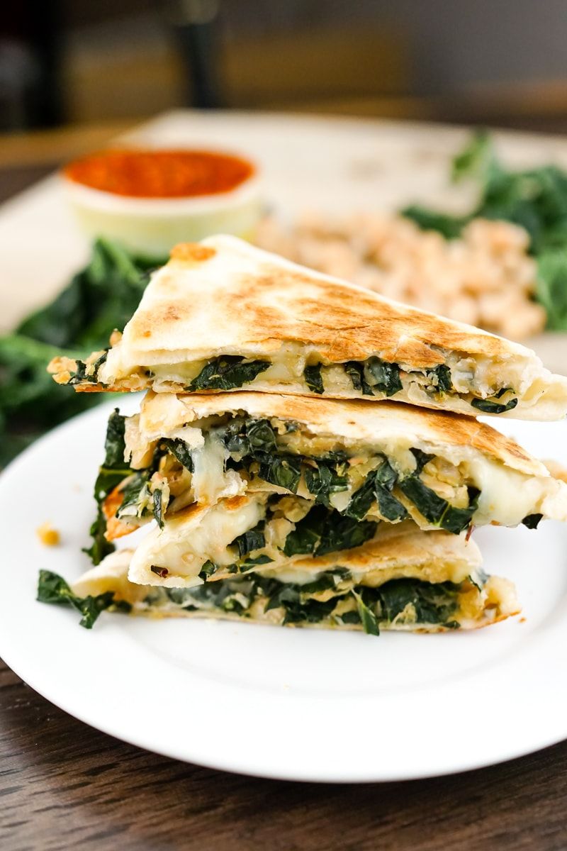 Rosemary White Bean and Kale Quesadilla cut into fourths and stacked.