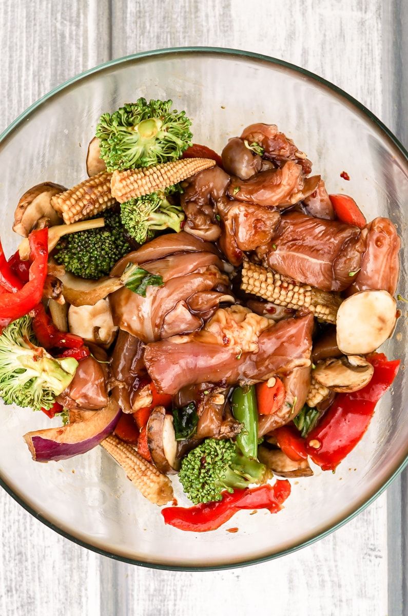 Sheet Pan Asian Chicken Stir Fry in a bowl marinating.