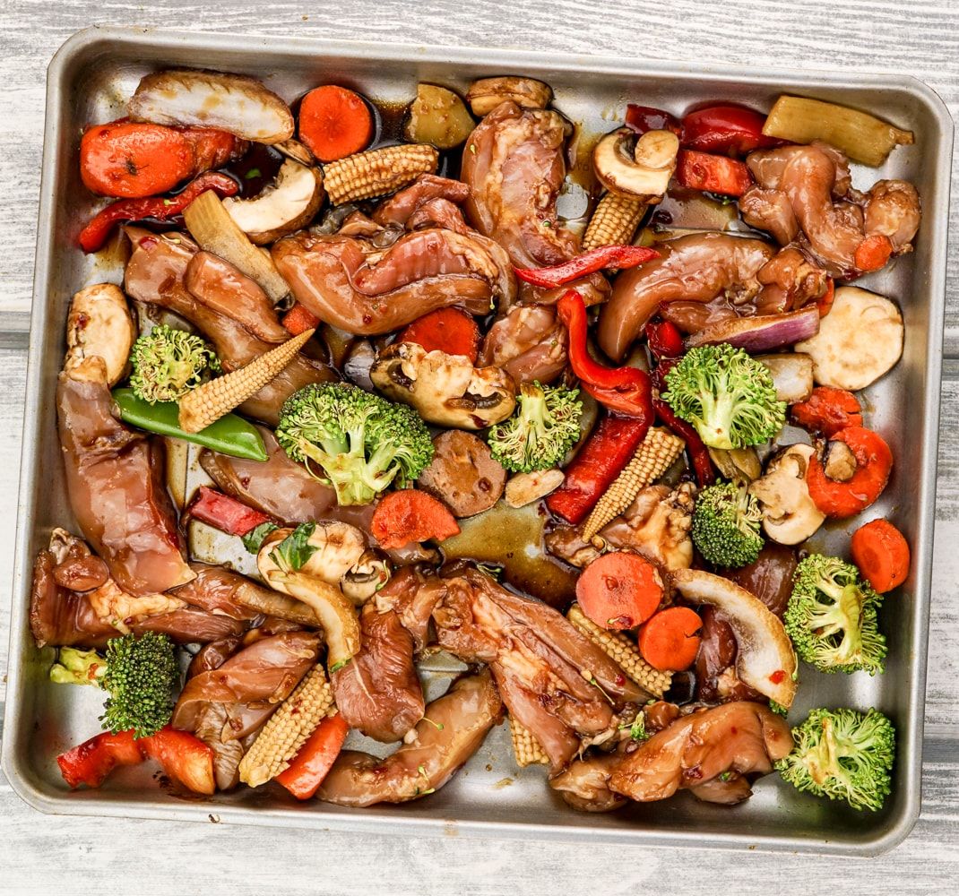 Sheet Pan Asian Chicken Stir Fry on the sheet pan before being cooked.