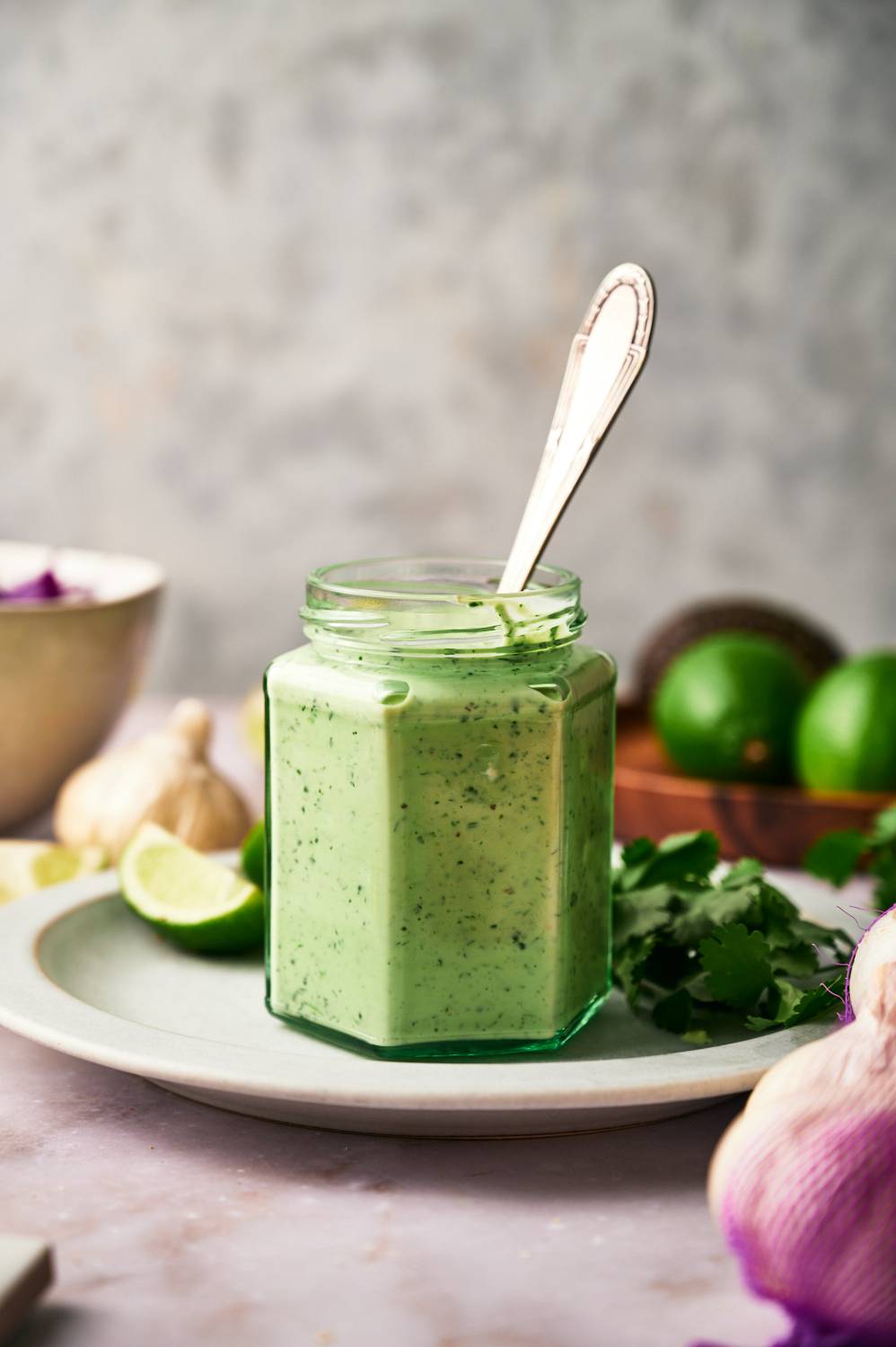 Jaw of shrimp taco sauce with cilantro, jalapeno, lime, garlic, green onions, yogurt, and mayonnaise.