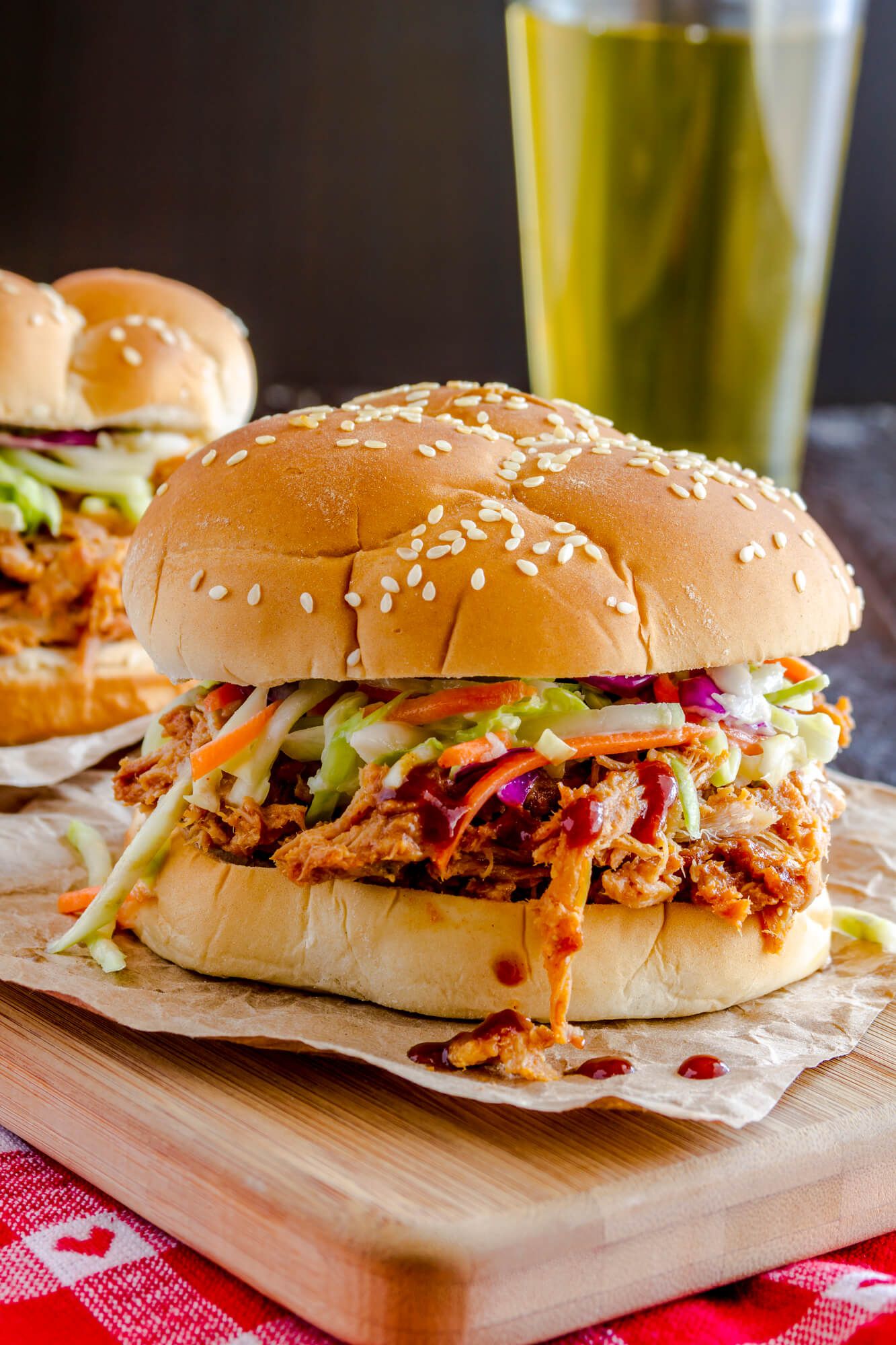 Slow Cooker Turkey Breast with Barbecue sauce on a sandwich roll with coleslaw.