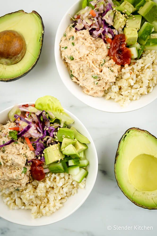 Spicy canned tuna bowls with avocado, cabbage, cucumber, and brown rice.