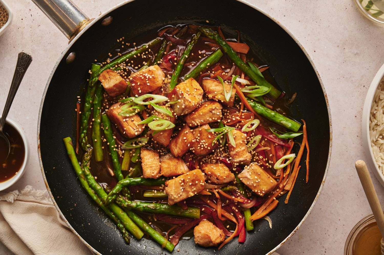 Stir fry made with salmon, asparagus, vegetables, and homemade stir fry sauce.