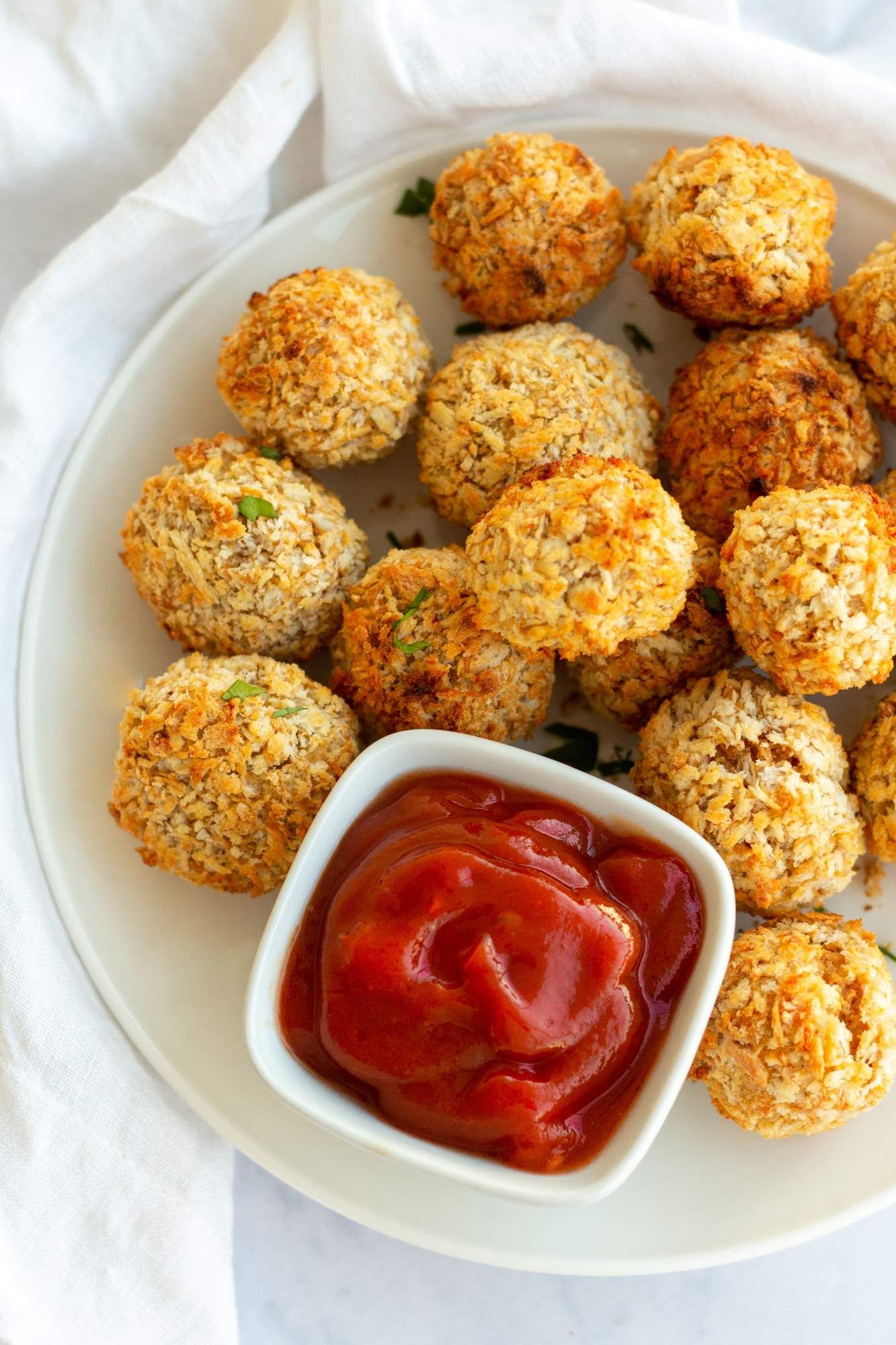 Vegetarian nuggets made with chickpeas and oat flour with crispy baked edges.