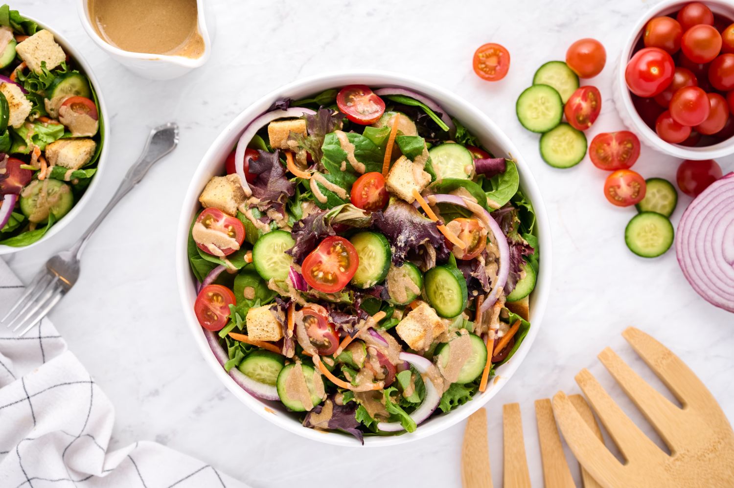 Spring mix salad with tomatoes, cucumbers, red onions, spring mix, and croutons with balsamic vinaigrette. 