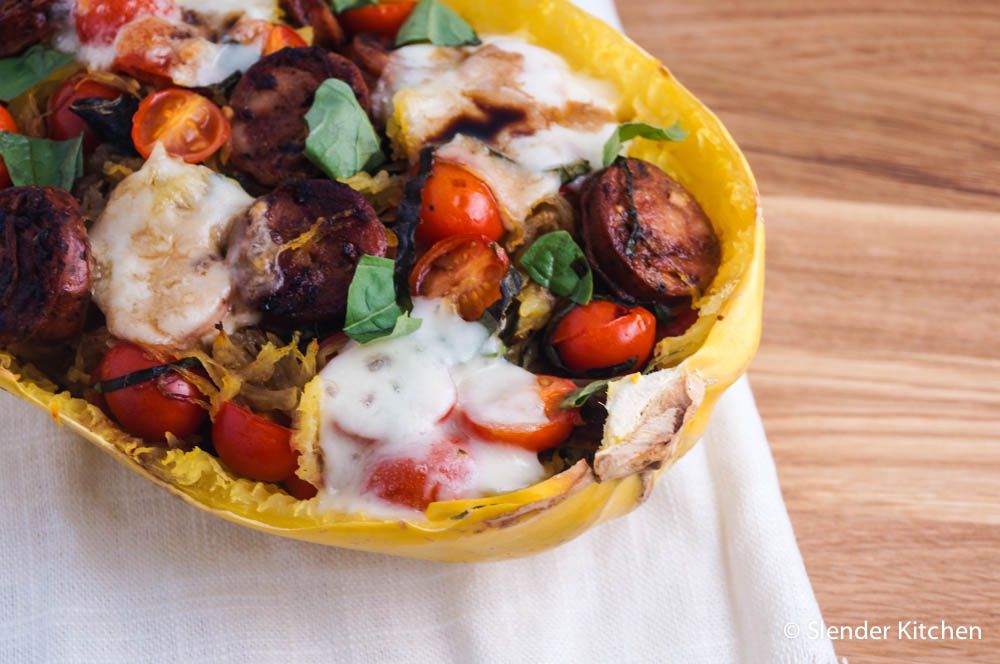 Spaghetti squash boat with chicken sausage, cherry tomatoes, and melted mozzarella cheese.