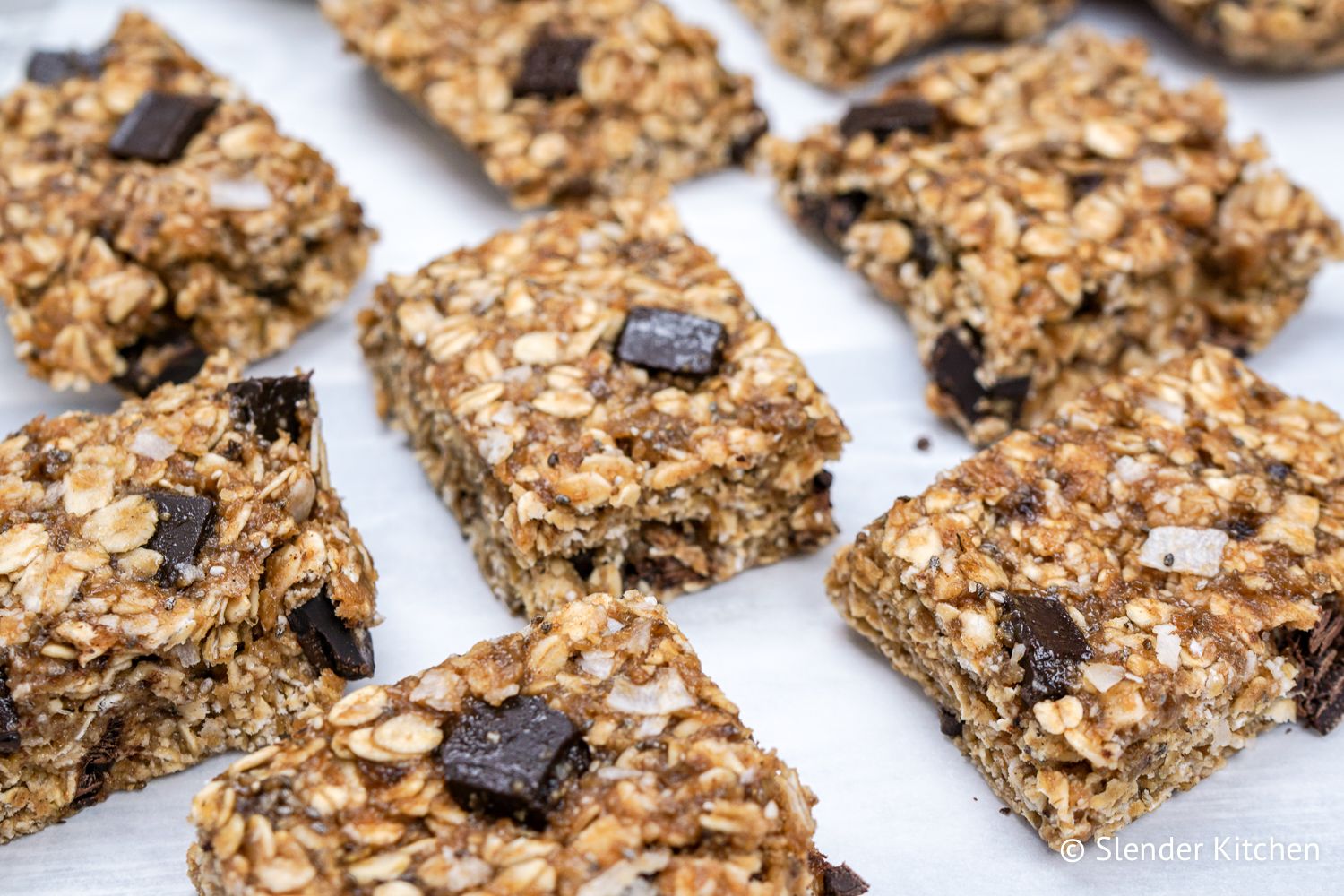 Healthy banana oat bar recipe with chocolate chips on parchment paper.