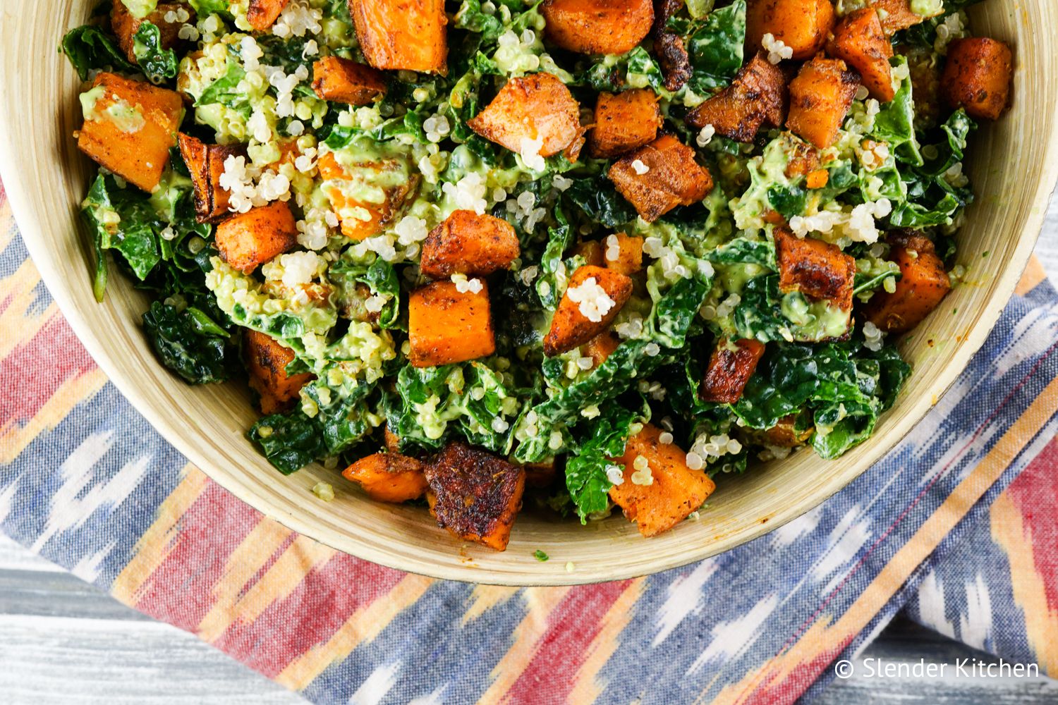 Sweet potato salad with kale and quinoa in a bowl.