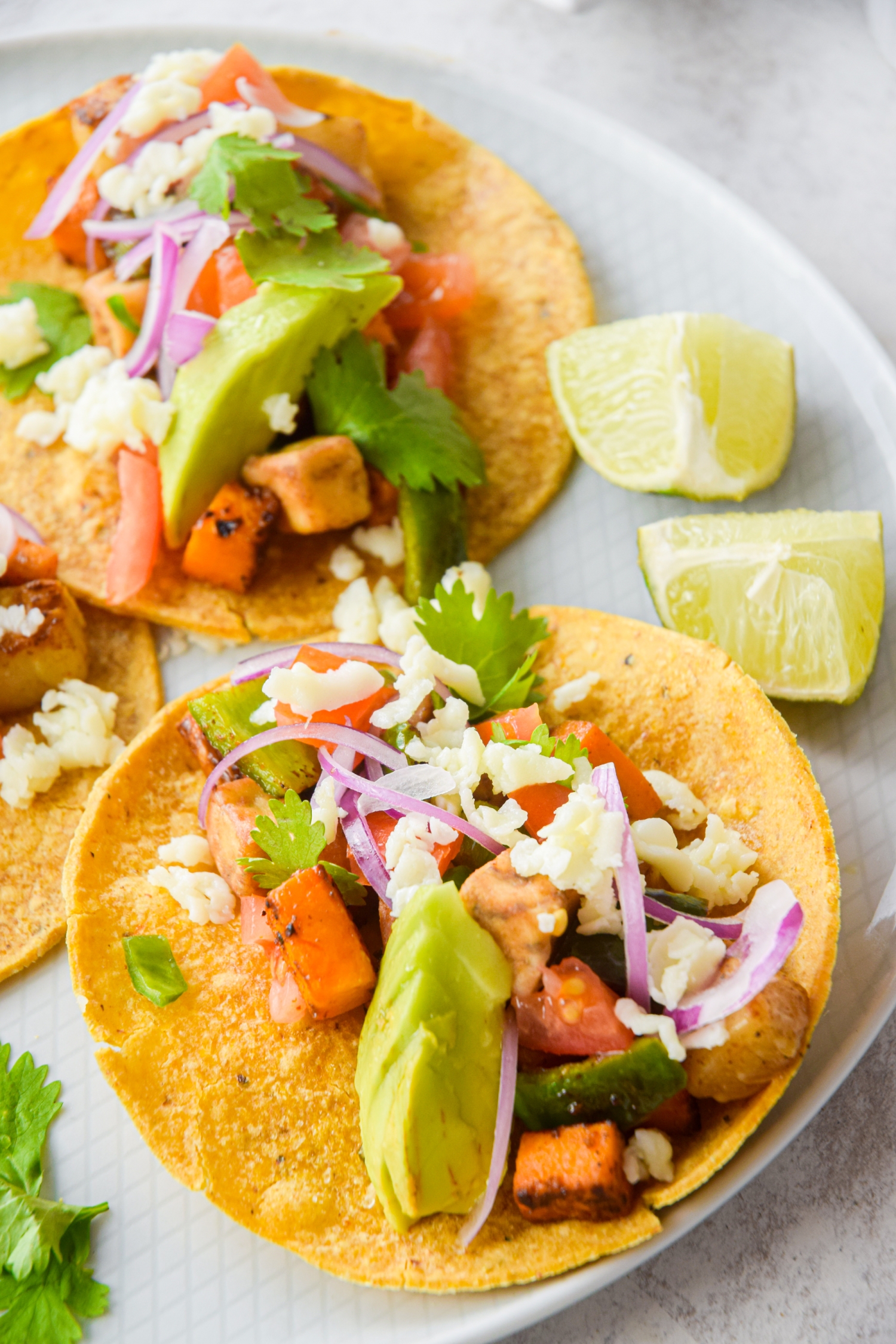 Roasted vegetable tostadas with zucchini, summer squash, avocado, and pico de gallo.