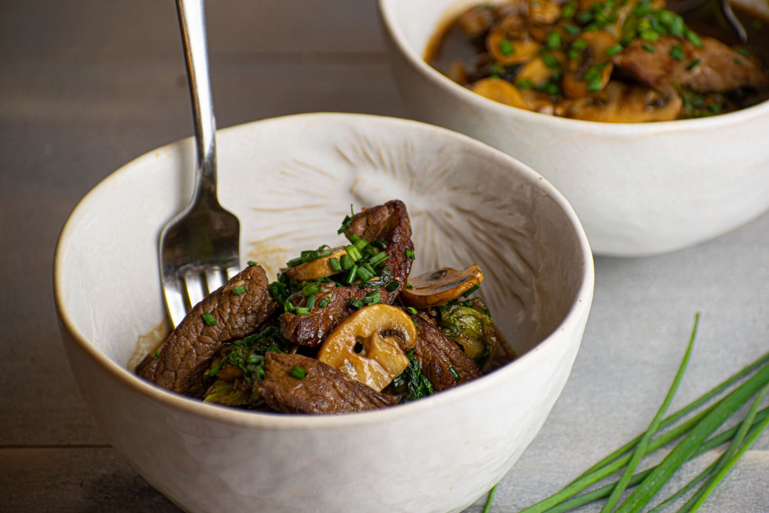 Beef boy choy stir fry with mushrooms and green onions in a soy stir fry sauce.