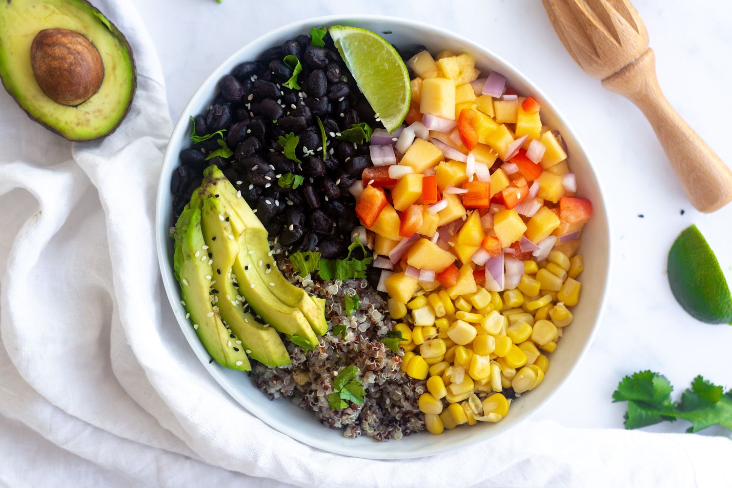 Cuban black bean bowl with bell peppers, cilantro, quinoa, and lime juice.