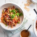 Asian peanut slaw with cabbage, jicama, carrots, cilantro, and edamame tossed in a peanut dressing.