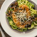 Balsamic chicken with mushrooms and Parmesan cheese over zucchini noodles.